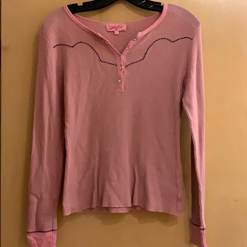 Pink shirt w/ rodeo theme on back and pink buttons